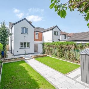 an image of a house with a garden at Station Road 3 bed semi detached in Belfast