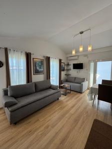 a living room with a couch and a table at Apartments Villa Marija in Petrovac na Moru +75 photos