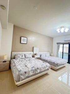 Postel nebo postele na pokoji v ubytování Dou Dou Long Homestay