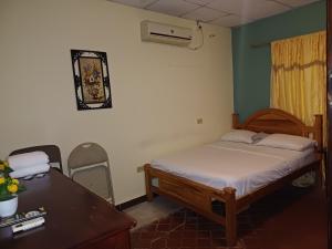 Postelja oz. postelje v sobi nastanitve BlueRock Hostal