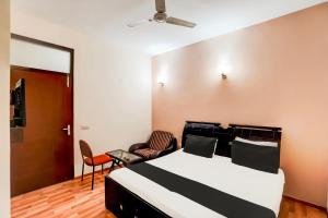 Postel nebo postele na pokoji v ubytování Hotel O Le Regent + 22 fotografií