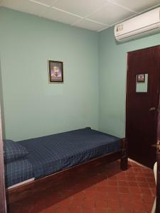 Postelja oz. postelje v sobi nastanitve BlueRock Hostal