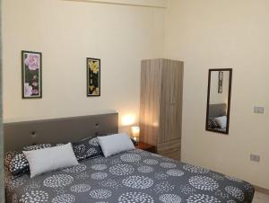 Ένα ή περισσότερα κρεβάτια σε δωμάτιο στο Casa Fabieddu