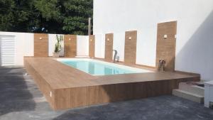 a swimming pool in the middle of a house at Beach House! in Ilhéus