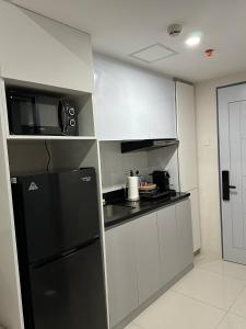 Kuchyň nebo kuchyňský kout v ubytování Cozy studio unit