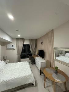 Postel nebo postele na pokoji v ubytování Cozy studio unit