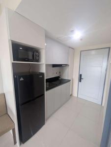 Kuchyň nebo kuchyňský kout v ubytování Cozy studio unit