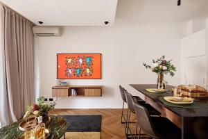 a dining room with a table and chairs at The Brass Flamingo on Oxford Street in Sydney +7 photos