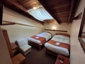 Postel nebo postele na pokoji v ubytování Andean Dreams 1
