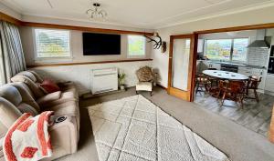 Χώρος καθιστικού στο Comfort & Warmth at Stag Lodge Near Queens Park