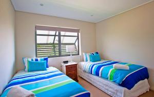 Postel nebo postele na pokoji v ubytování Beach Karma - Three-Bedroom Beachside Escape with Heated Communal Pool in Agnes Water + 37 fotografií