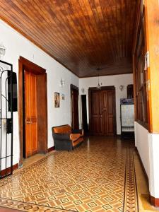 a living room with a couch and a wooden ceiling at Hotel Casa don Angel in Las Victorias