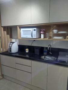 Η κουζίνα ή μικρή κουζίνα στο Apartamento, Studio, Loft - GO Rio Branco, próximo HCPA e HPS
