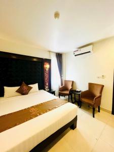 Postel nebo postele na pokoji v ubytování HỒNG ANH 1 HOTEL + 32 fotografií