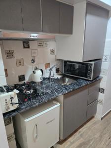 Kuchyň nebo kuchyňský kout v ubytování AMueblados GRANERO