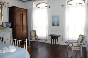 Χώρος καθιστικού στο Chambres d'Hôtes L'Enclos des Jacobins