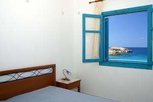 Llit o llits en una habitació de Nefeli Apartments