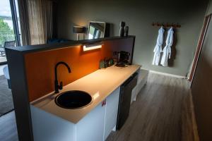 a bathroom with a sink and a counter at Wilderluxe Lake Keepit in Keepit