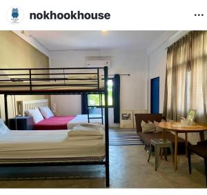 Postel nebo postele na pokoji v ubytování Nokhook House