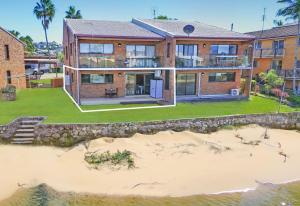 an aerial view of a house on the beach at Barooga1- Mooloolaba Canal Front Apartment in Mooloolaba