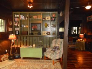 a living room with a chair and a table at The Stables in Kingston