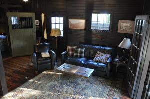 a living room with a couch and a coffee table at The Stables in Kingston