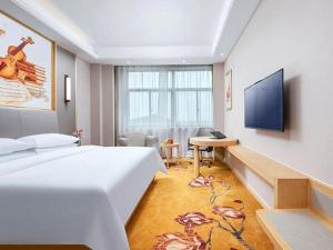 Postel nebo postele na pokoji v ubytování Vienna Hotel Shanghai Songjiang Xiaokunshan
