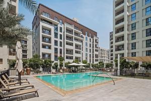 an image of a swimming pool in a building at Harbour Retreat Stunning Community Views in Dubai