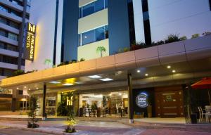 a view of a building with a restaurant at Hotel Finlandia in Quito