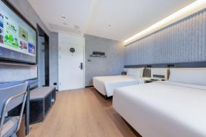 Ένα ή περισσότερα κρεβάτια σε δωμάτιο στο Atour Light Hotel Beijing Zhongguancun Renmin University