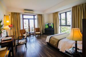 Ein Bett oder Betten in einem Zimmer der Unterkunft Sun Spa Resort & Villa