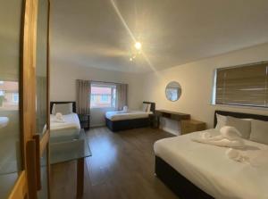 Ένα ή περισσότερα κρεβάτια σε δωμάτιο στο Guest Suite at The Grand Hotel