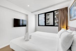 Letto o letti in una camera di Breeze 801