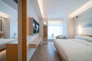 Postel nebo postele na pokoji v ubytování H-Hotel Riverside Chengdu + 231 fotografií