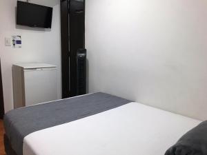 Postel nebo postele na pokoji v ubytování Hotel Castellon Plaza Pereira