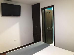 Postel nebo postele na pokoji v ubytování Hotel Castellon Plaza Pereira