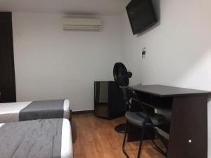 TV a/nebo společenská místnost v ubytování Hotel Castellon Plaza Pereira