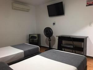 Postel nebo postele na pokoji v ubytování Hotel Castellon Plaza Pereira