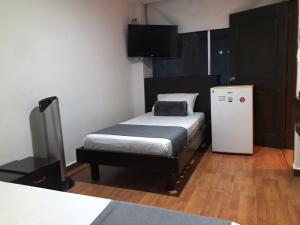 Postel nebo postele na pokoji v ubytování Hotel Castellon Plaza Pereira