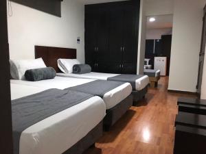 Postel nebo postele na pokoji v ubytování Hotel Castellon Plaza Pereira