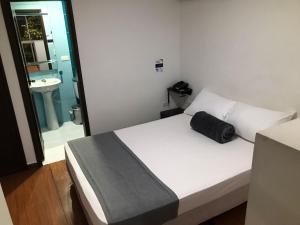 Postel nebo postele na pokoji v ubytování Hotel Castellon Plaza Pereira