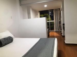 Postel nebo postele na pokoji v ubytování Hotel Castellon Plaza Pereira
