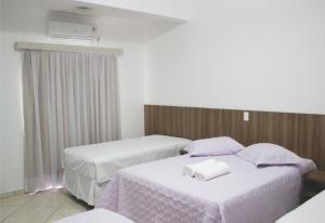 Cama ou camas em um quarto em Hotel Dorta's