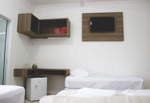 Postel nebo postele na pokoji v ubytování Hotel Dorta's