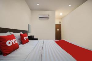 Postel nebo postele na pokoji v ubytování OYO 939 69 Resort + 73 fotografií