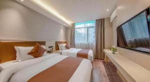 Postel nebo postele na pokoji v ubytování Gya Hotel Shanghai Long Distance Passenger Terminal Station