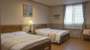 Postel nebo postele na pokoji v ubytování Champs Yazuh B&B