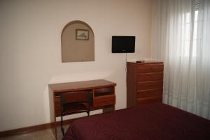 Cama o camas de una habitación en Hostal Hermanos Gutierrez