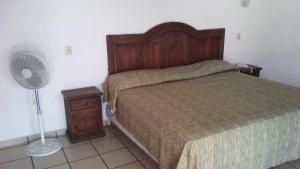 a bedroom with a bed and a fan at Hotel Real de Cuautla in Cuautla Morelos +31 photos