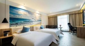 Un pat sau paturi într-o cameră la hailihotel